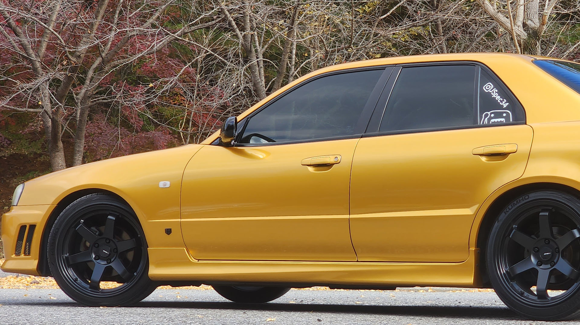JSpec34 R34 Skyline wrapped in tinybot vinyl secret gold on street